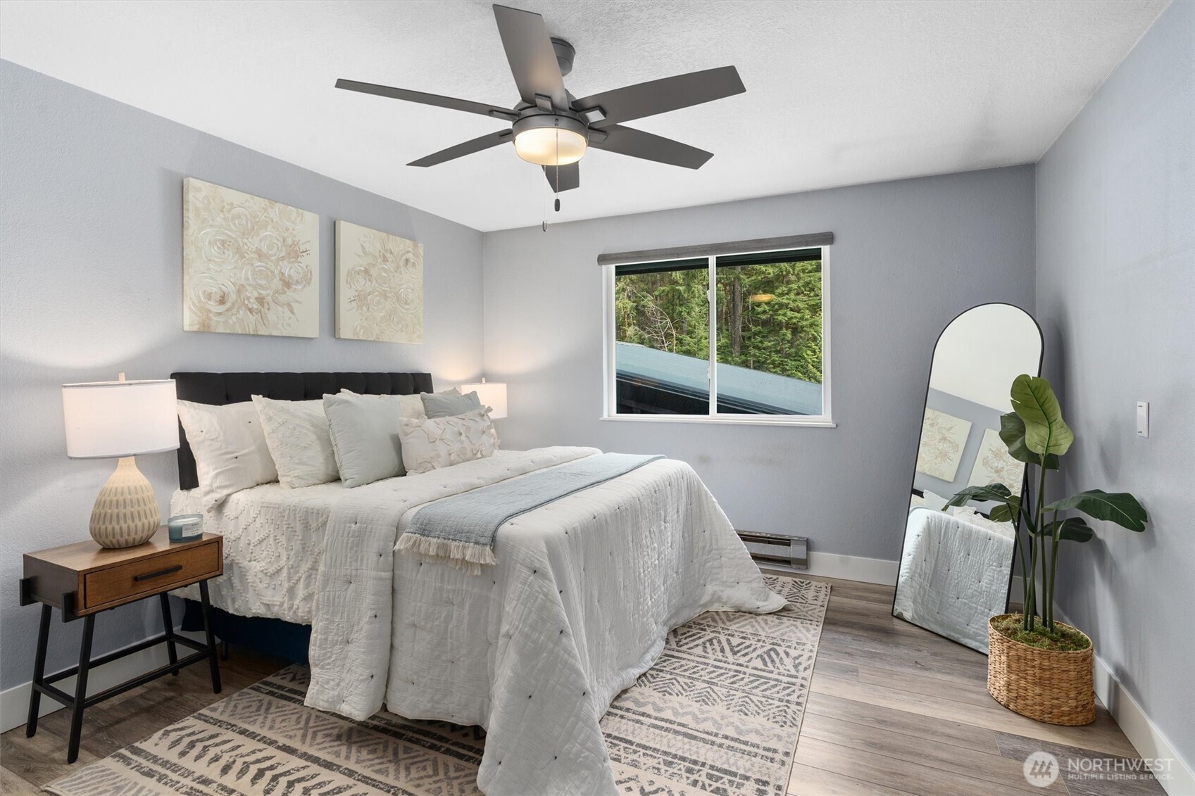 17629 Newberg Road Snohomish, WA 98290 - Photo 26 of 40 a bedroom with bed and a chandelier