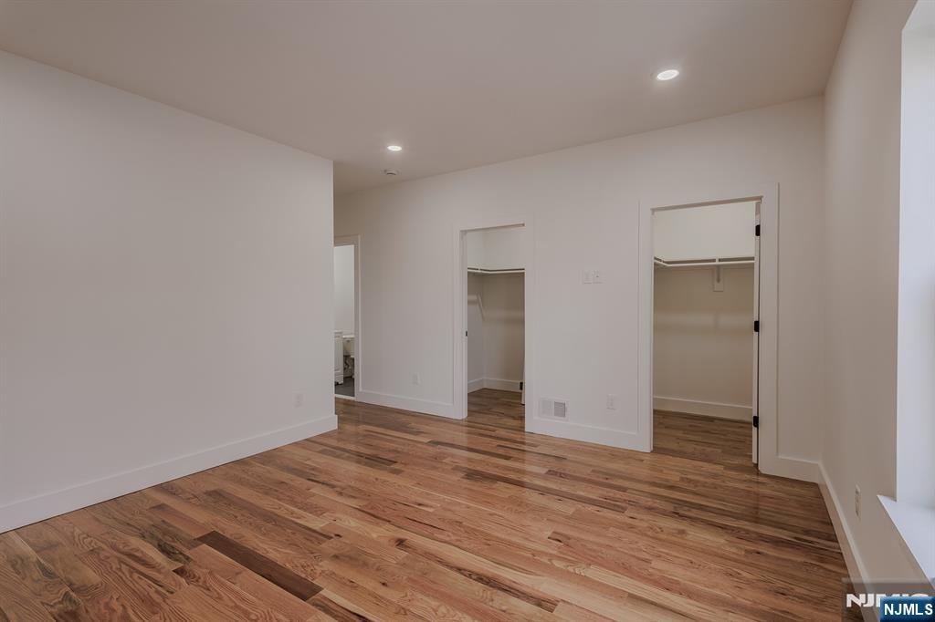 29 Kent Street Newark, NJ 07108 - Photo 19 of 30 wooden floor in an empty room with wooden floor