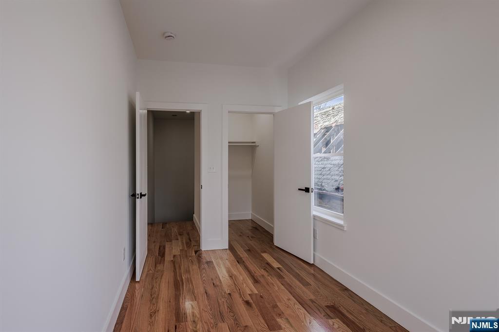 29 Kent Street Newark, NJ 07108 - Photo 26 of 30 a view of wooden floor in an empty room