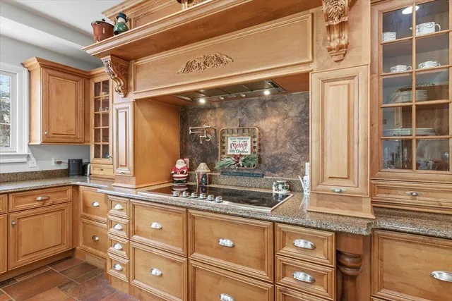 a living room with a bed furniture and a large window