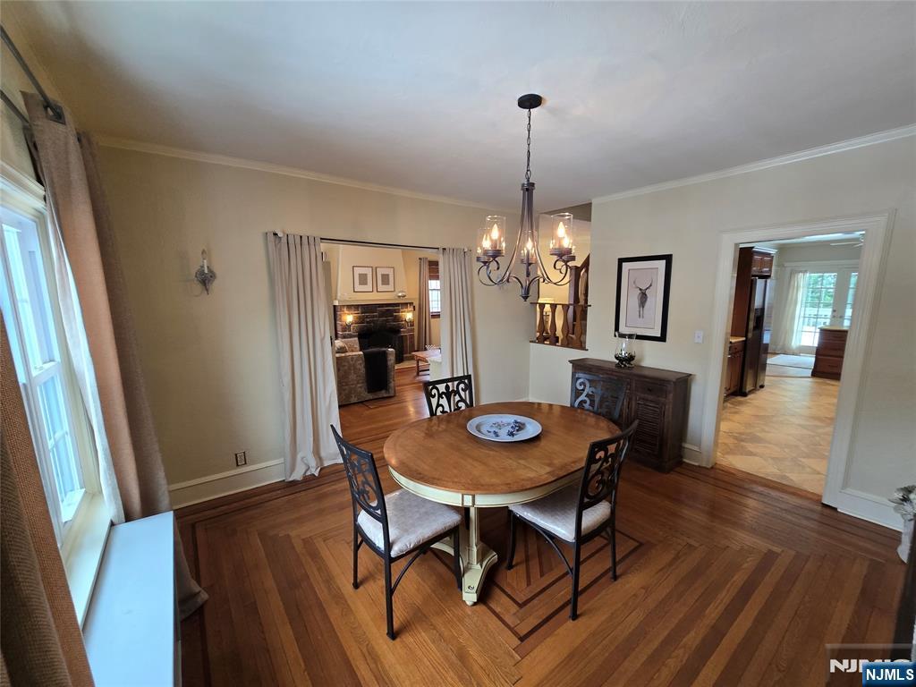 224 Cleveland Avenue Hasbrouck Heights, NJ 07604 - Photo 11 of 29 a view of a dining room with furniture wooden floor and chandelier