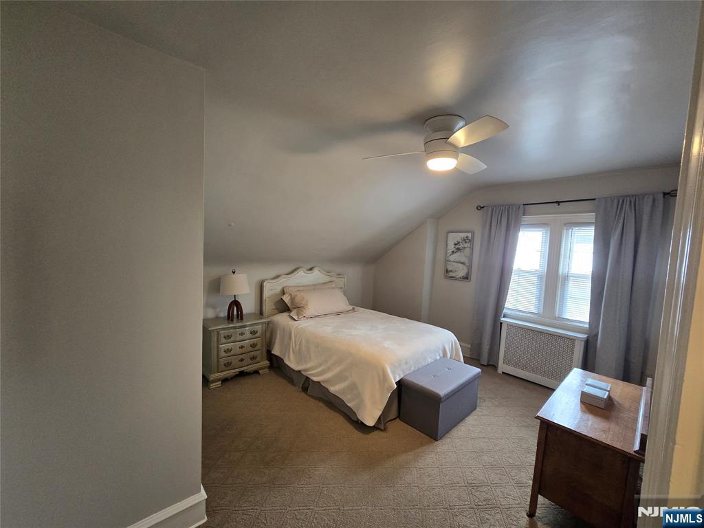 224 Cleveland Avenue Hasbrouck Heights, NJ 07604 - Photo 14 of 29 a bedroom with a bed and a window