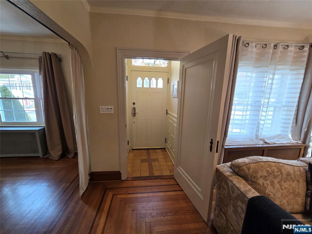 224 Cleveland Avenue Hasbrouck Heights, NJ 07604 - Photo 2 of 29 a view of a hallway with wooden floor and staircase