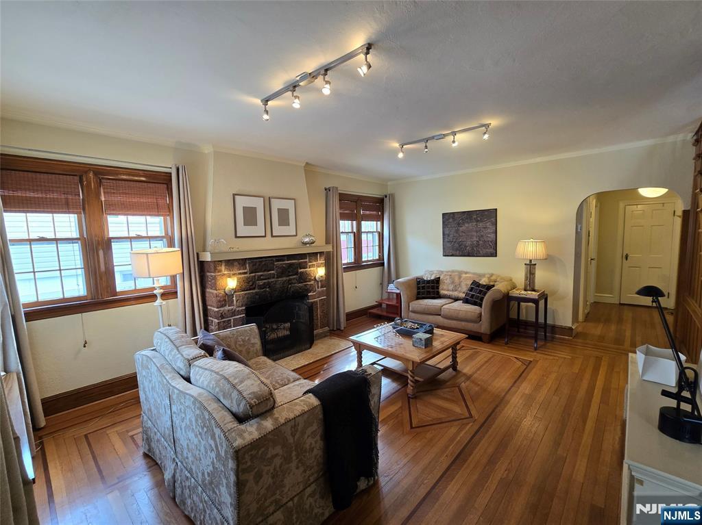 224 Cleveland Avenue Hasbrouck Heights, NJ 07604 - Photo 6 of 29 a living room with furniture fireplace and wooden floor