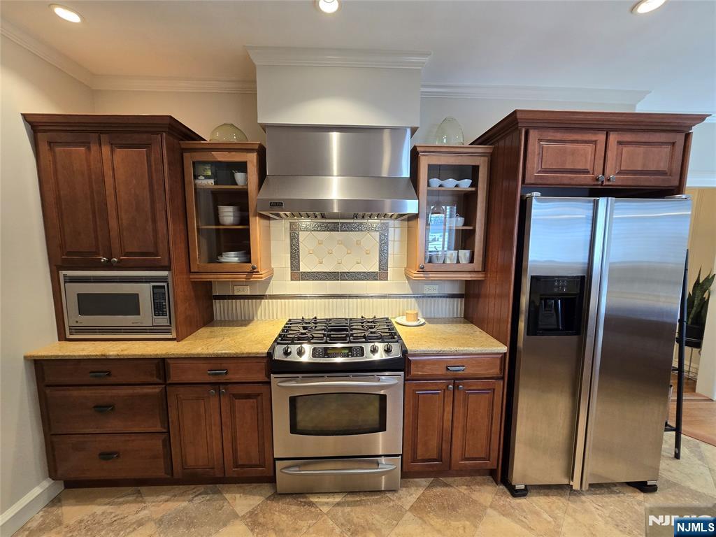 224 Cleveland Avenue Hasbrouck Heights, NJ 07604 - Photo 8 of 29 a kitchen with stainless steel appliances granite countertop a stove and a refrigerator