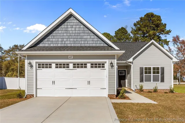 a front view of a house with a garage