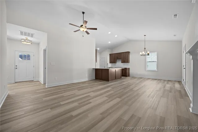 a view of a kitchen with a sink and a microwave