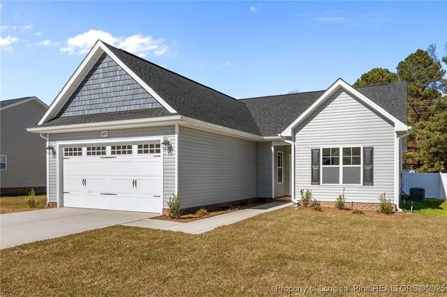 a view of a house with a garage