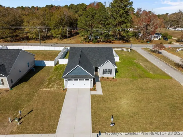 a aerial view of a house with swimming pool