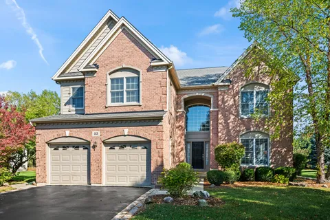 front view of a house with a garden