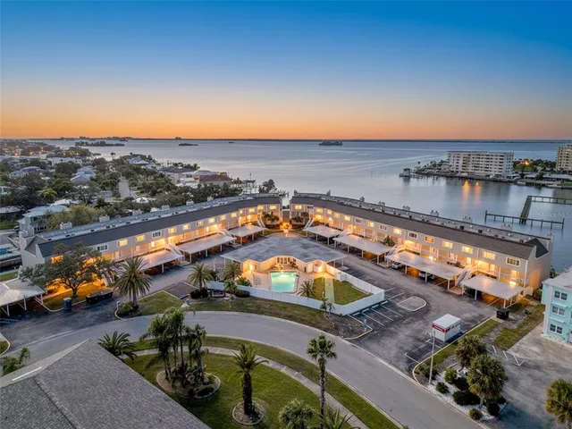 an aerial view of a house with a ocean beach