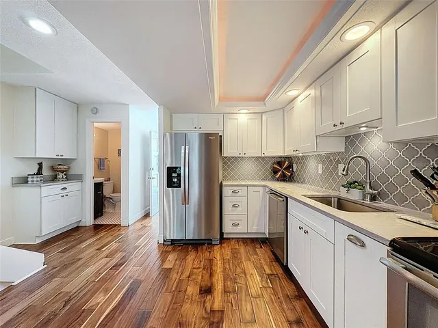 a bedroom with furniture and a flat screen tv