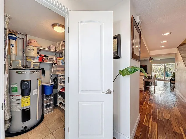 a kitchen with white cabinets and appliances