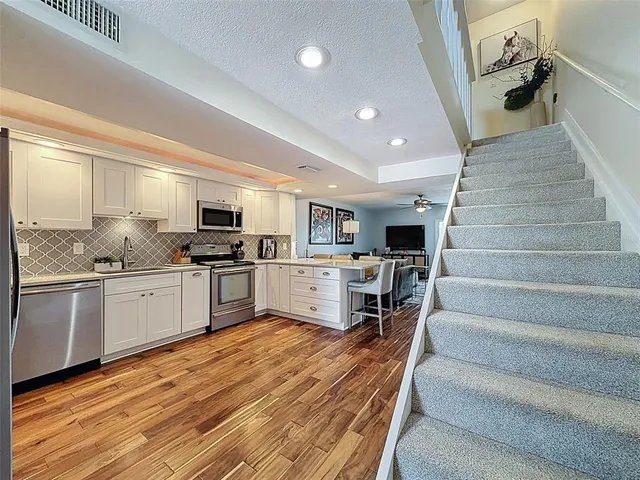 a spacious bedroom with a bed and a window