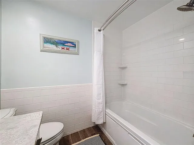 a bed room with a bed and a chandelier