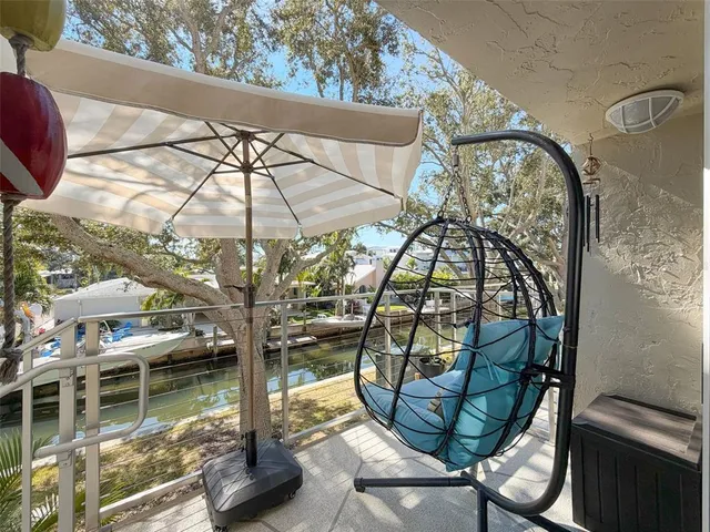 a view of a house with a tree in front