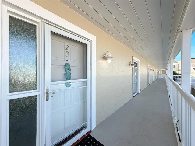 a kitchen with white cabinets stainless steel appliances and sink