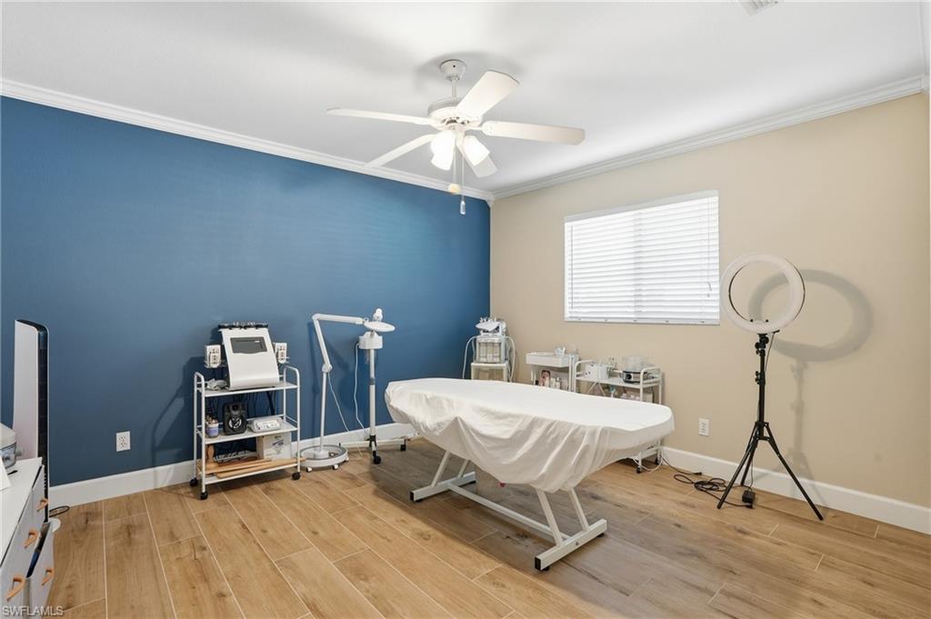 272 Johnnycake Drive Naples, FL 34110 - Photo 21 of 33 a room with a table chairs and a chandelier