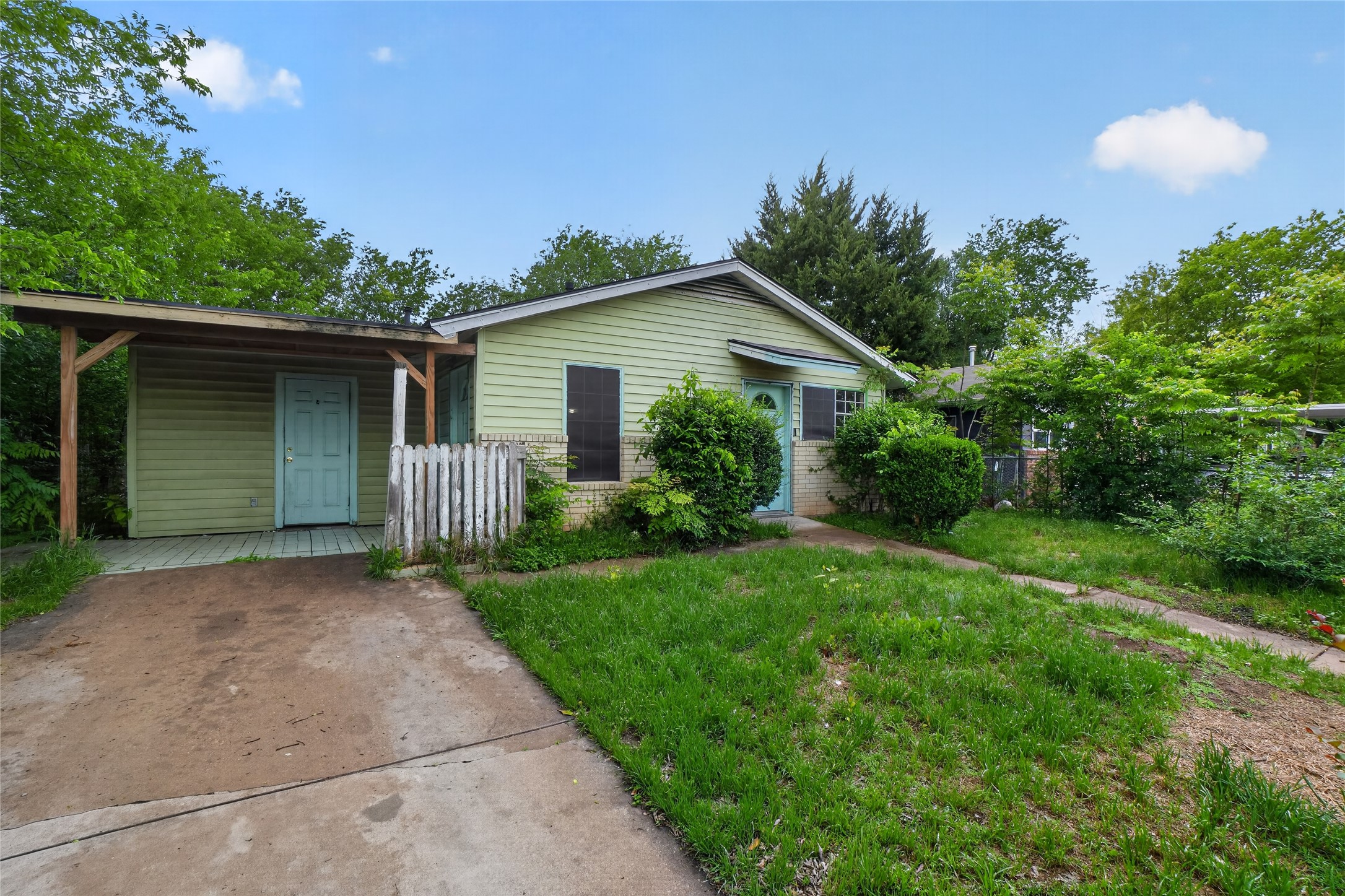 6015 Carnation Terrace Austin, TX 78741 - Photo 1 of 12 a front view of house with yard and trees