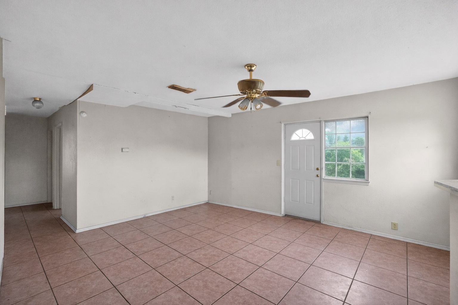 6015 Carnation Terrace Austin, TX 78741 - Photo 6 of 12 a view of an empty room with a window