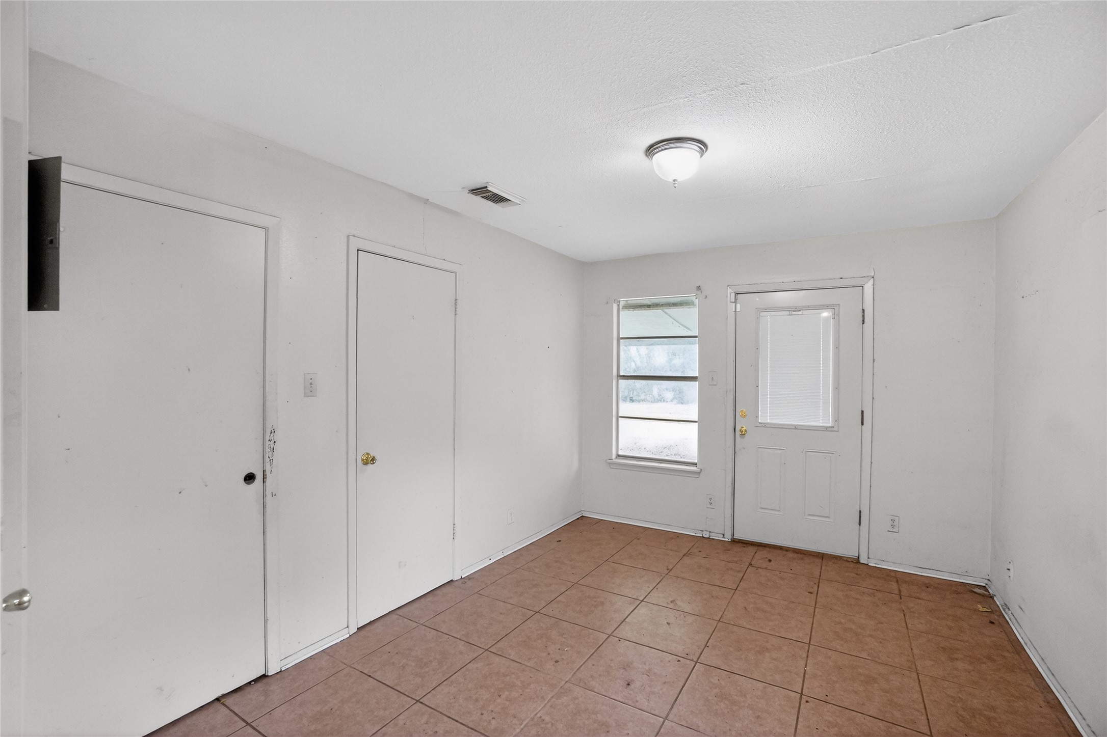 6015 Carnation Terrace Austin, TX 78741 - Photo 7 of 12 a view of an empty room and window