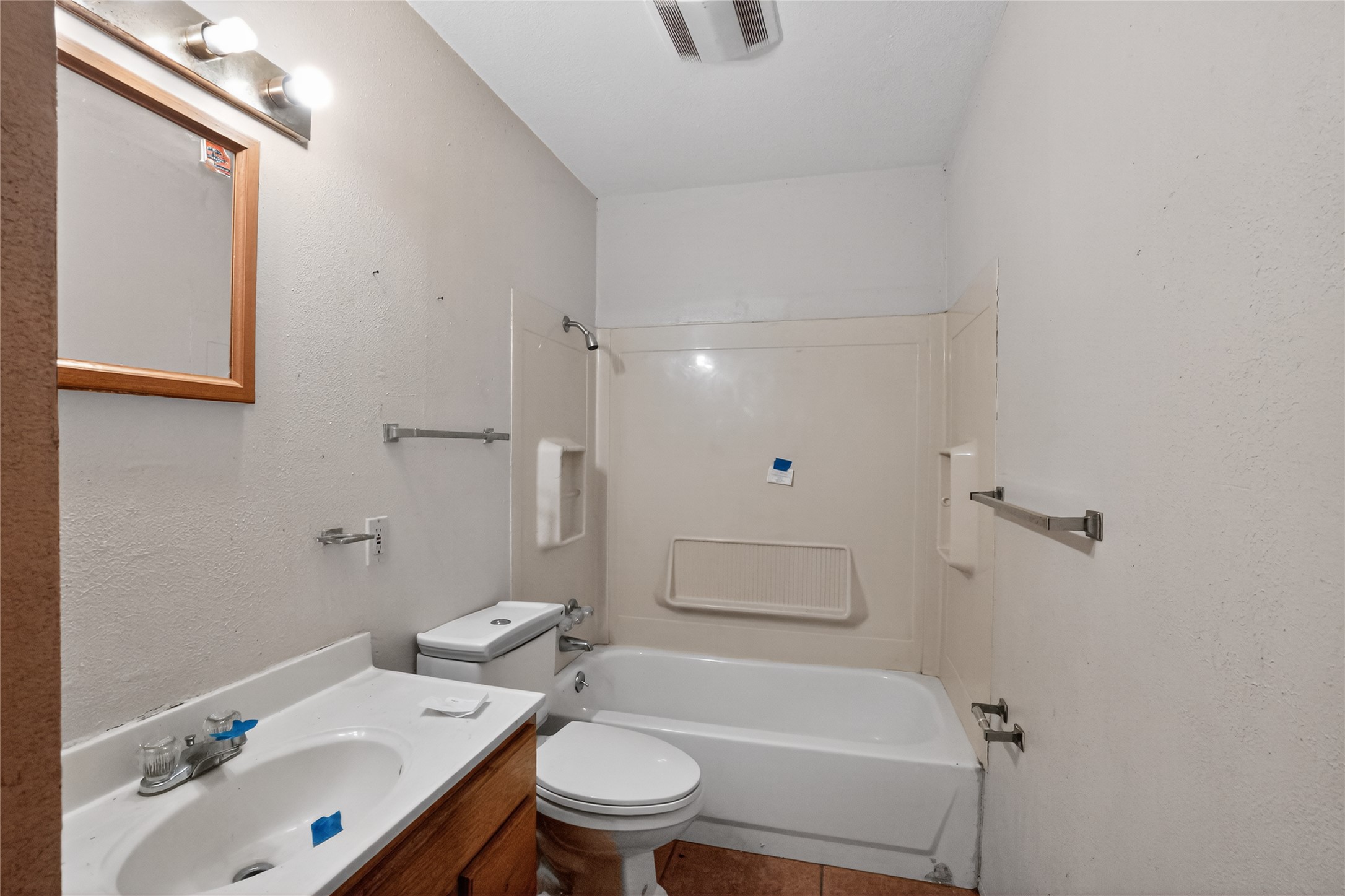 6015 Carnation Terrace Austin, TX 78741 - Photo 10 of 12 a bathroom with a sink toilet and shower