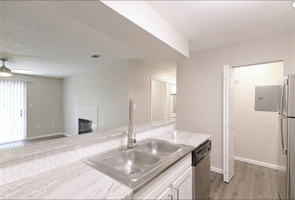 1108 Bridle Trail Coraopolis, PA 15108 - Photo 6 of 12 a kitchen with a sink cabinets and a refrigerator