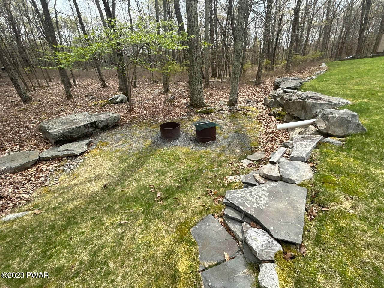 131 Maple Ridge Road Milford, PA 18337 - Photo 44 of 54 a view of swimming pool with a yard and sitting area