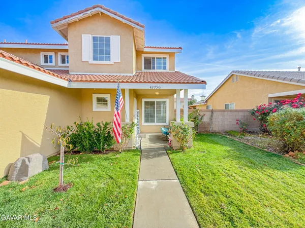 a view of a house with a big yard