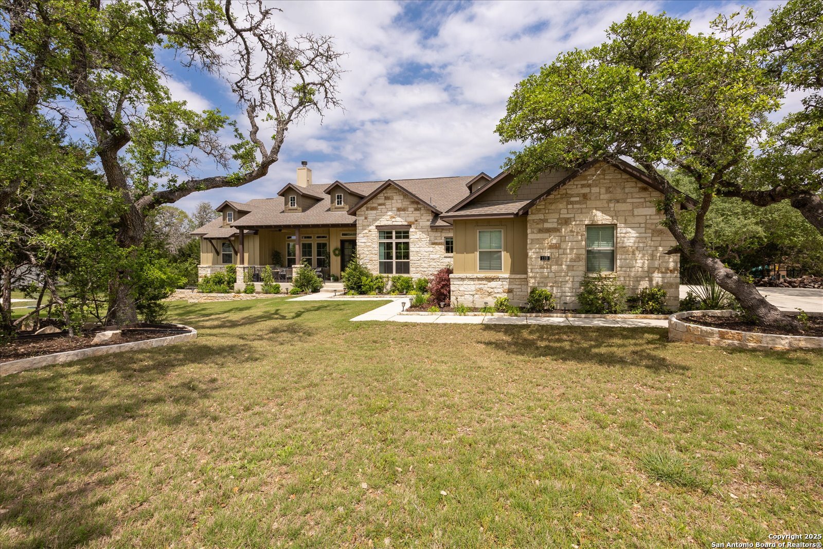 110 Madrone Trail Boerne, TX 78006 - Photo 1 of 1 a front view of a house with swimming pool and porch