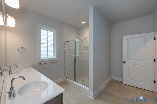 a bathroom with 2 sink tub and a mirror
