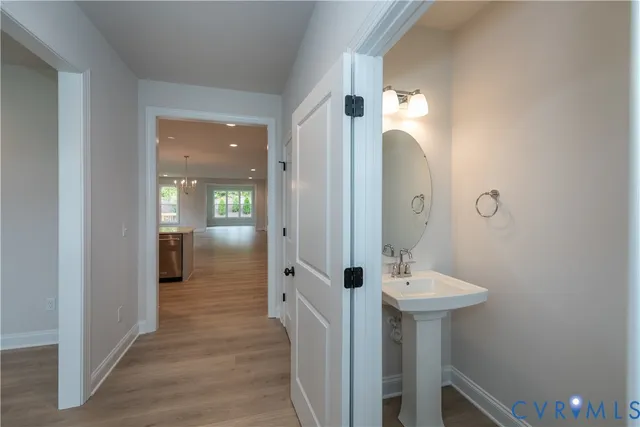 a bathroom with a sink a mirror and shower