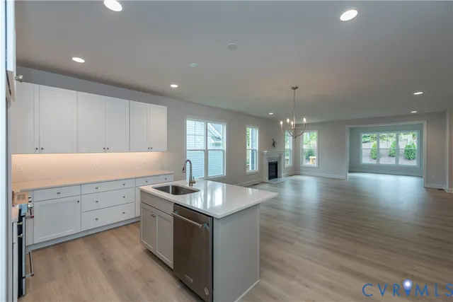 a kitchen with granite countertop a stove and a sink