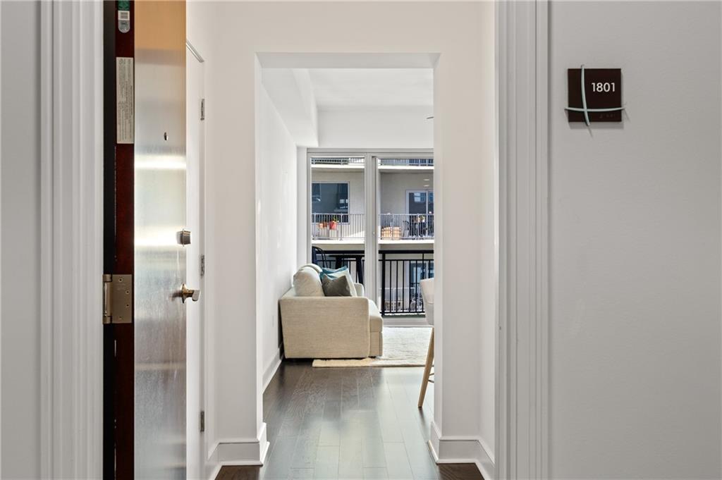 222 12th Street Northeast, Unit 1801 Atlanta, GA 30309 - Photo 3 of 50 a view of kitchen with livingroom and furniture