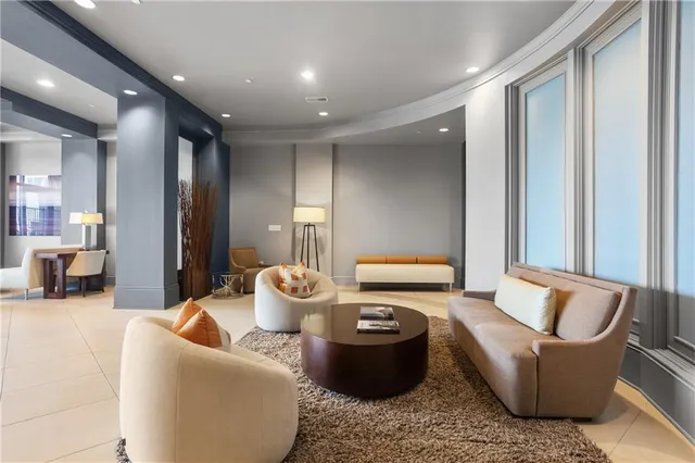 a living room with furniture and a large window