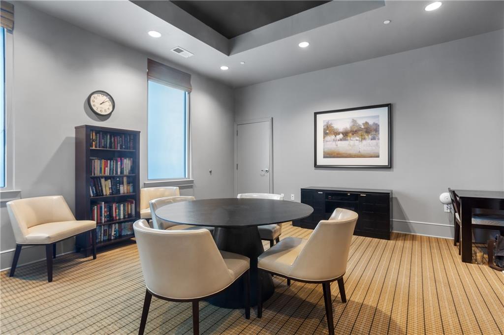 222 12th Street Northeast, Unit 1801 Atlanta, GA 30309 - Photo 44 of 50 a living room with furniture and a wooden floor
