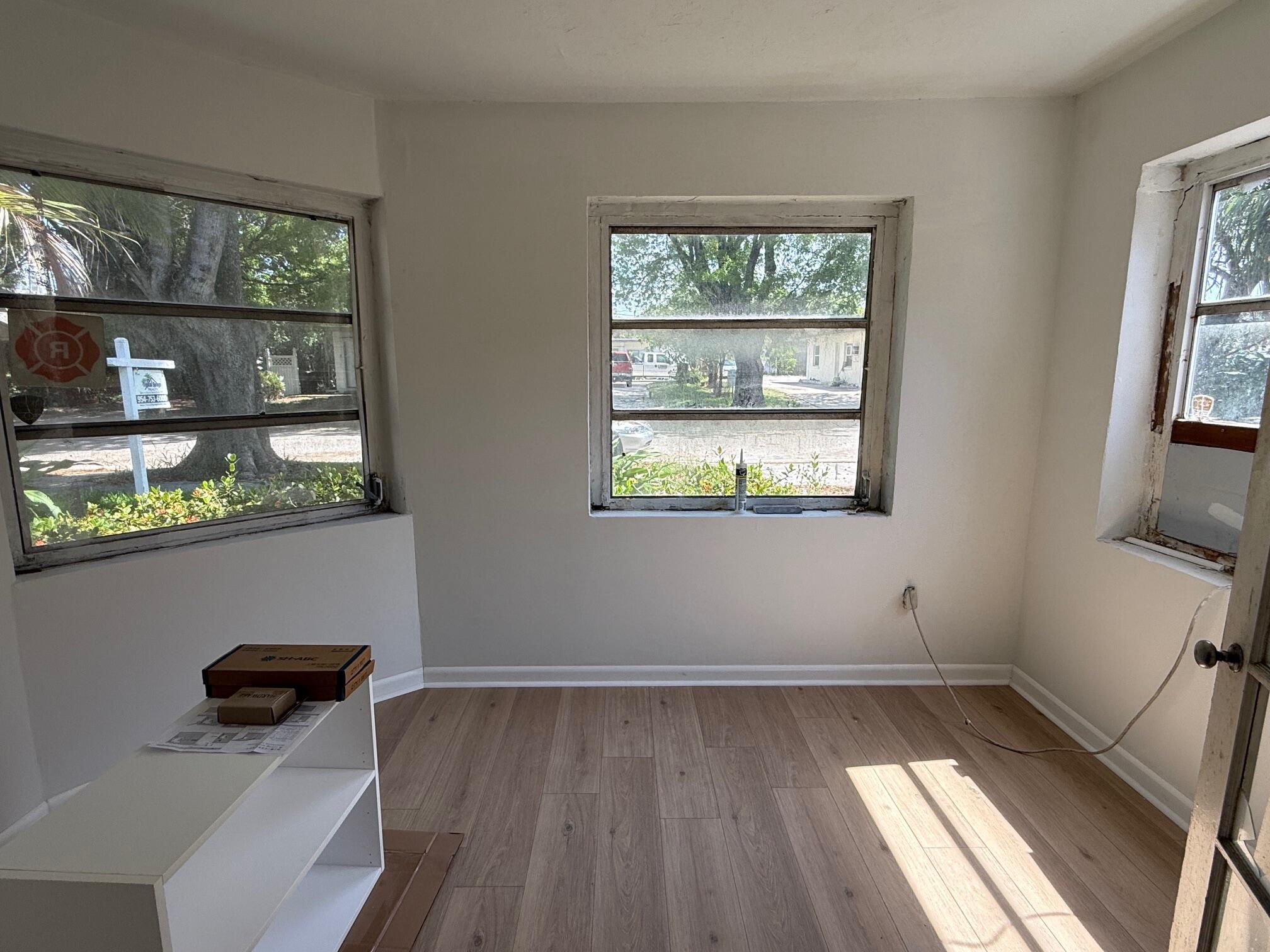 523 48th Street West Palm Beach, FL 33407 - Photo 11 of 33 a room with window and wooden floor