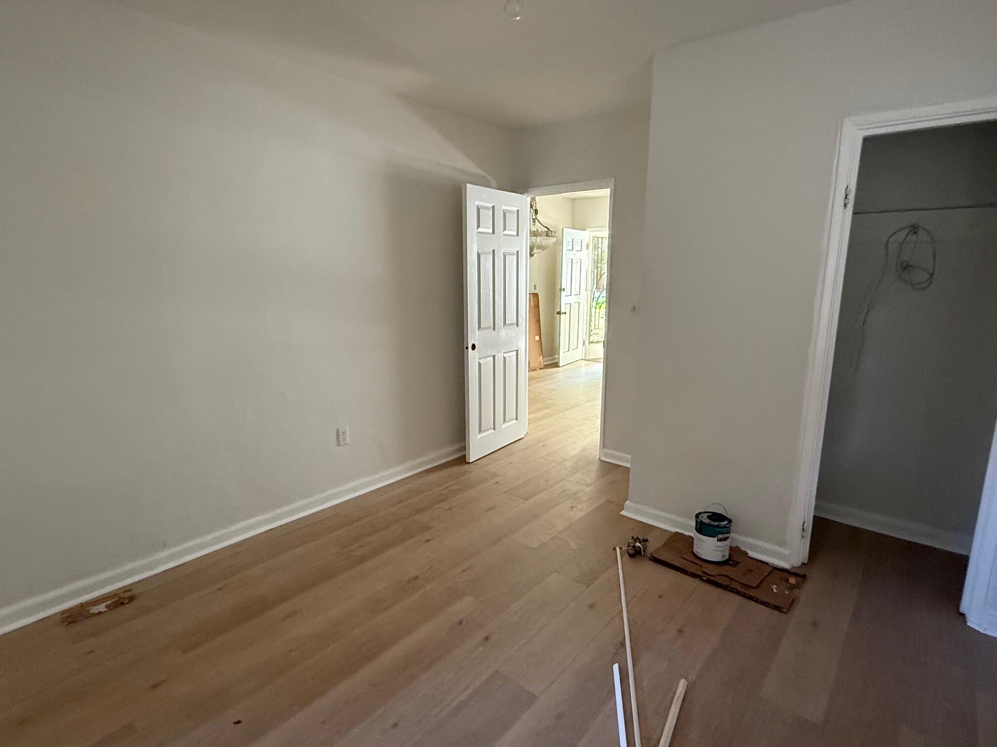 523 48th Street West Palm Beach, FL 33407 - Photo 13 of 33 an empty room with wooden floor and windows