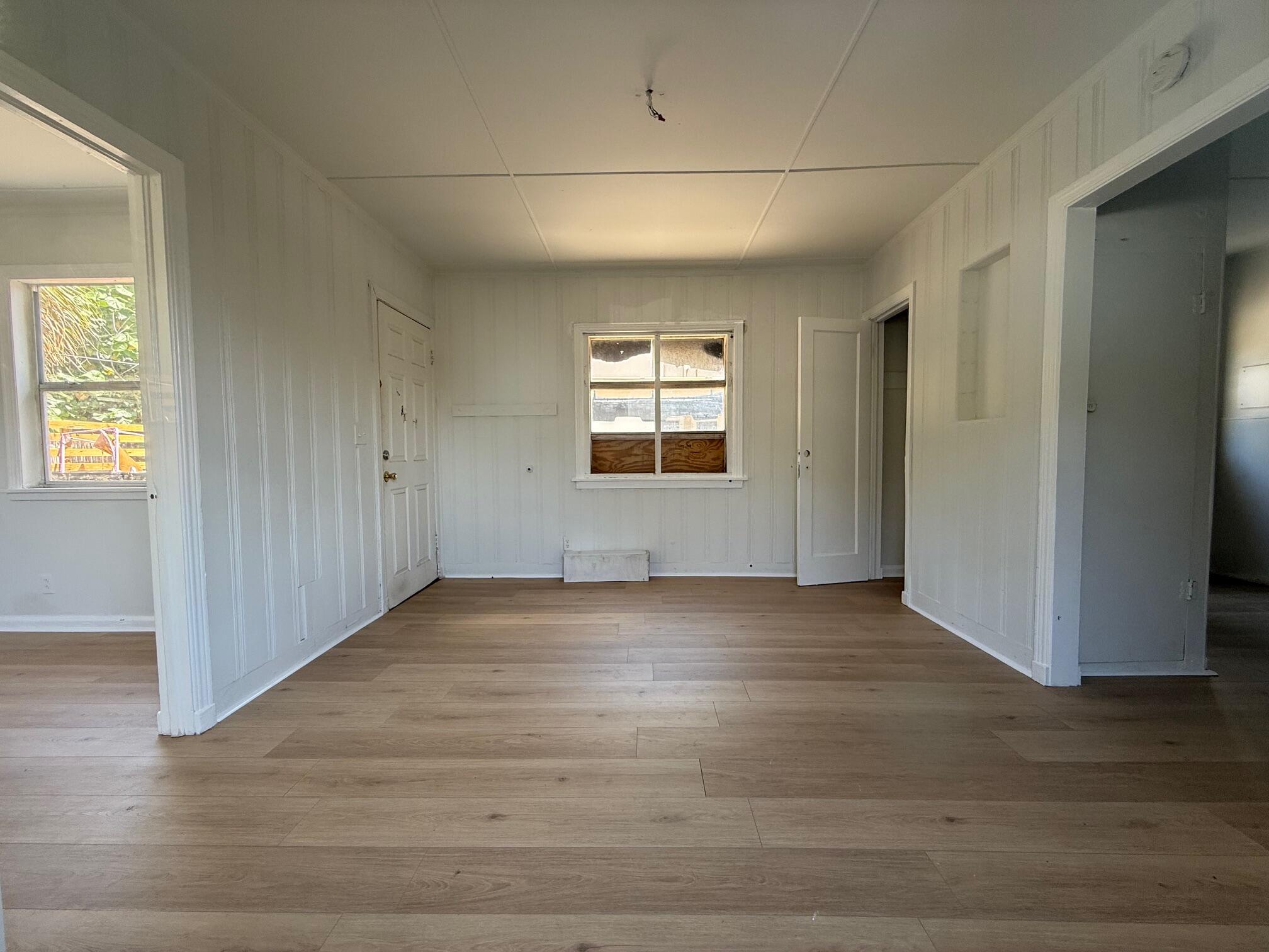 523 48th Street West Palm Beach, FL 33407 - Photo 19 of 33 an empty room with wooden floor and windows