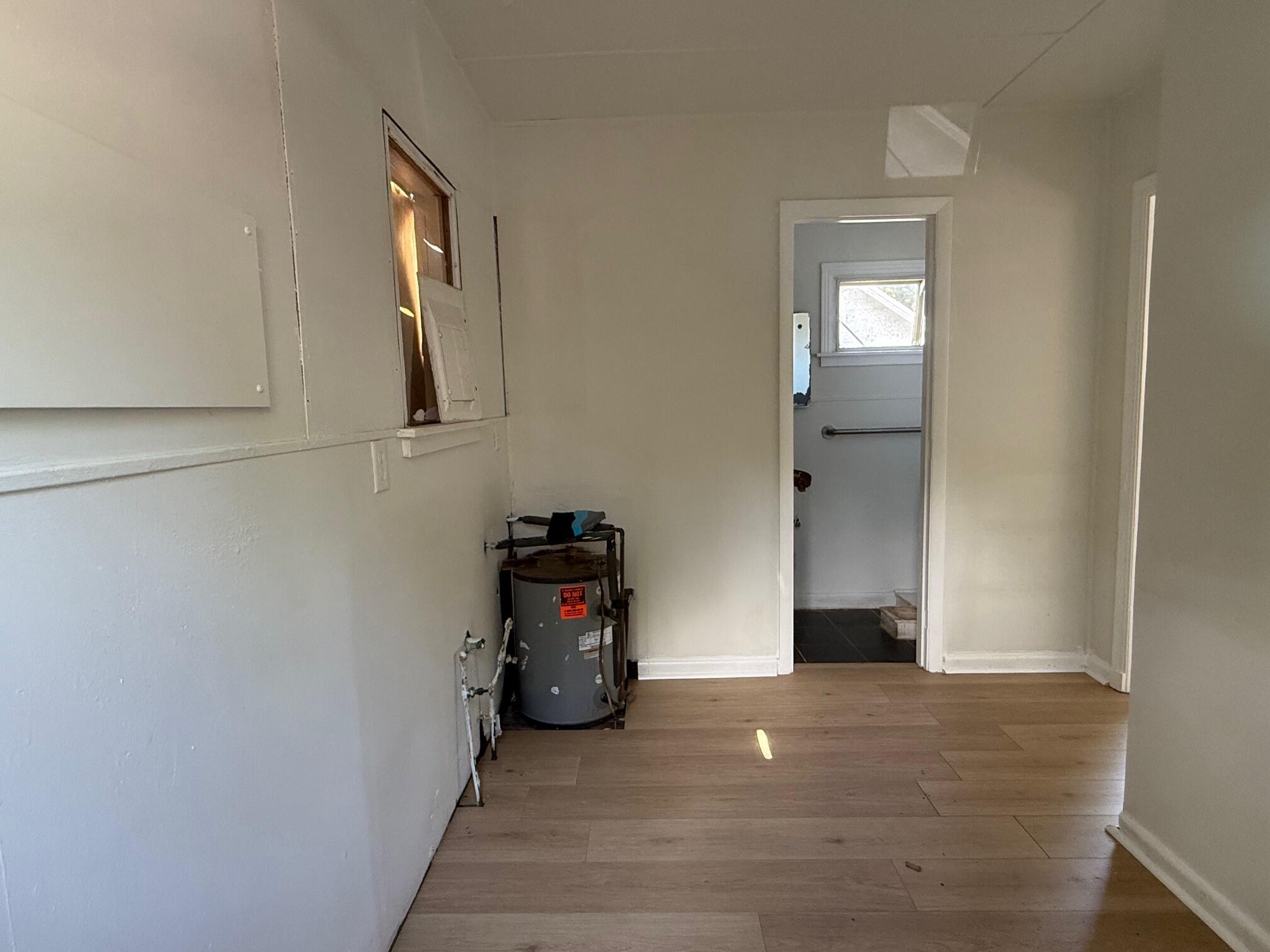 523 48th Street West Palm Beach, FL 33407 - Photo 21 of 33 a view of a livingroom with wooden floor and a window
