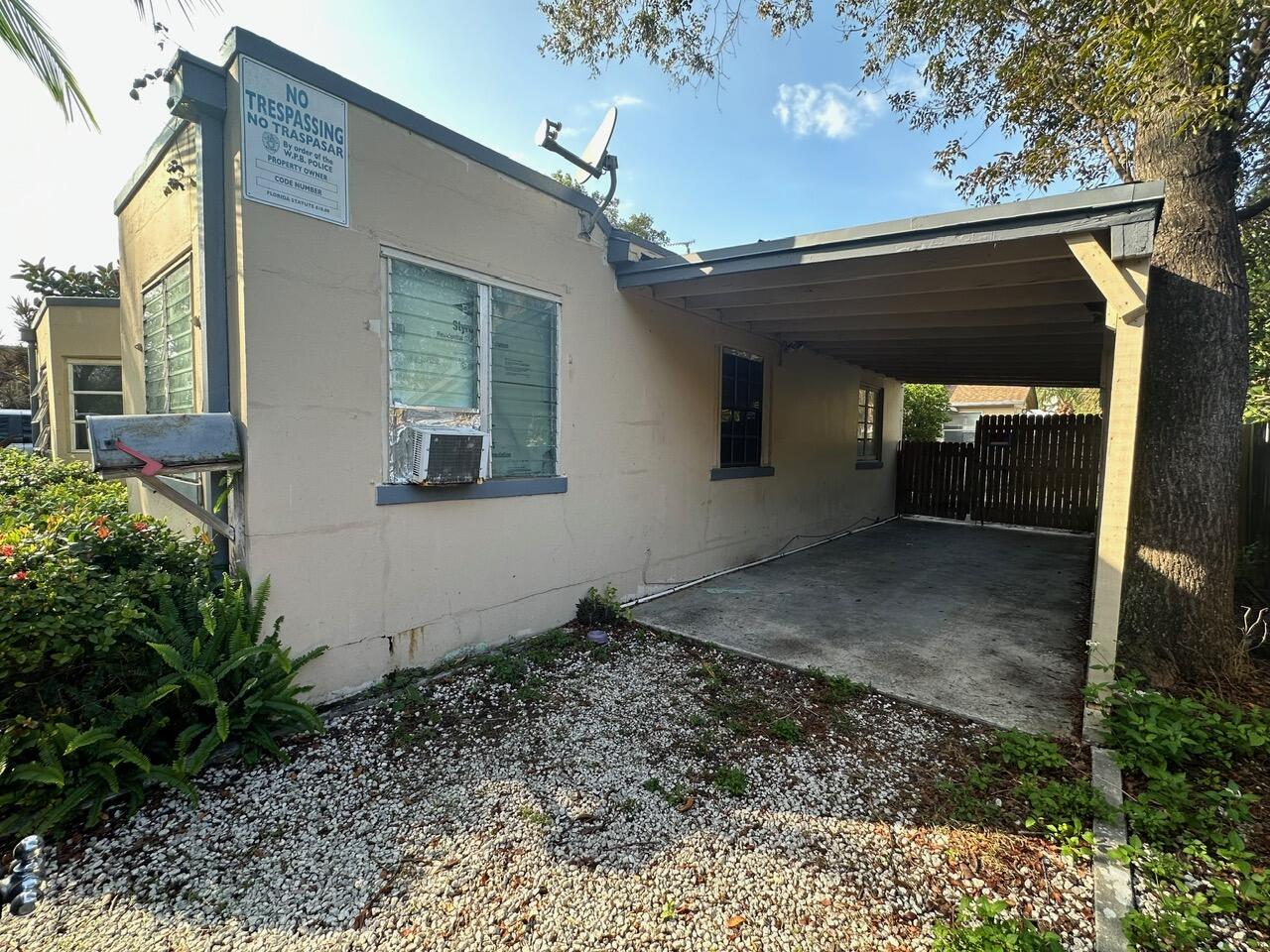 523 48th Street West Palm Beach, FL 33407 - Photo 30 of 33 a view of a house with a yard