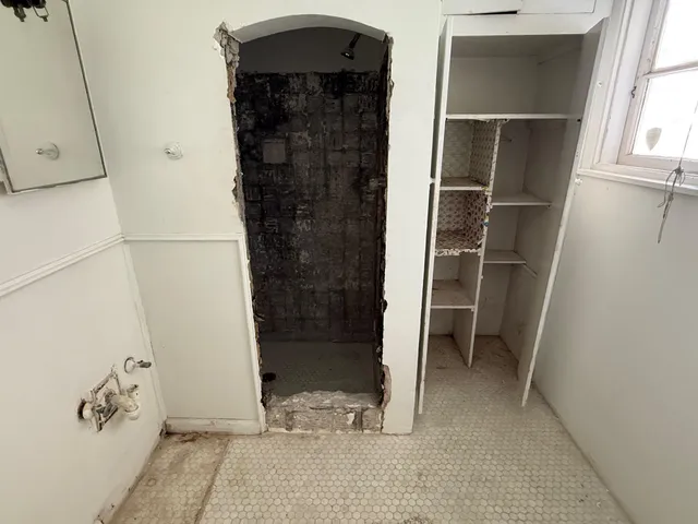 a view of walk in closet with window