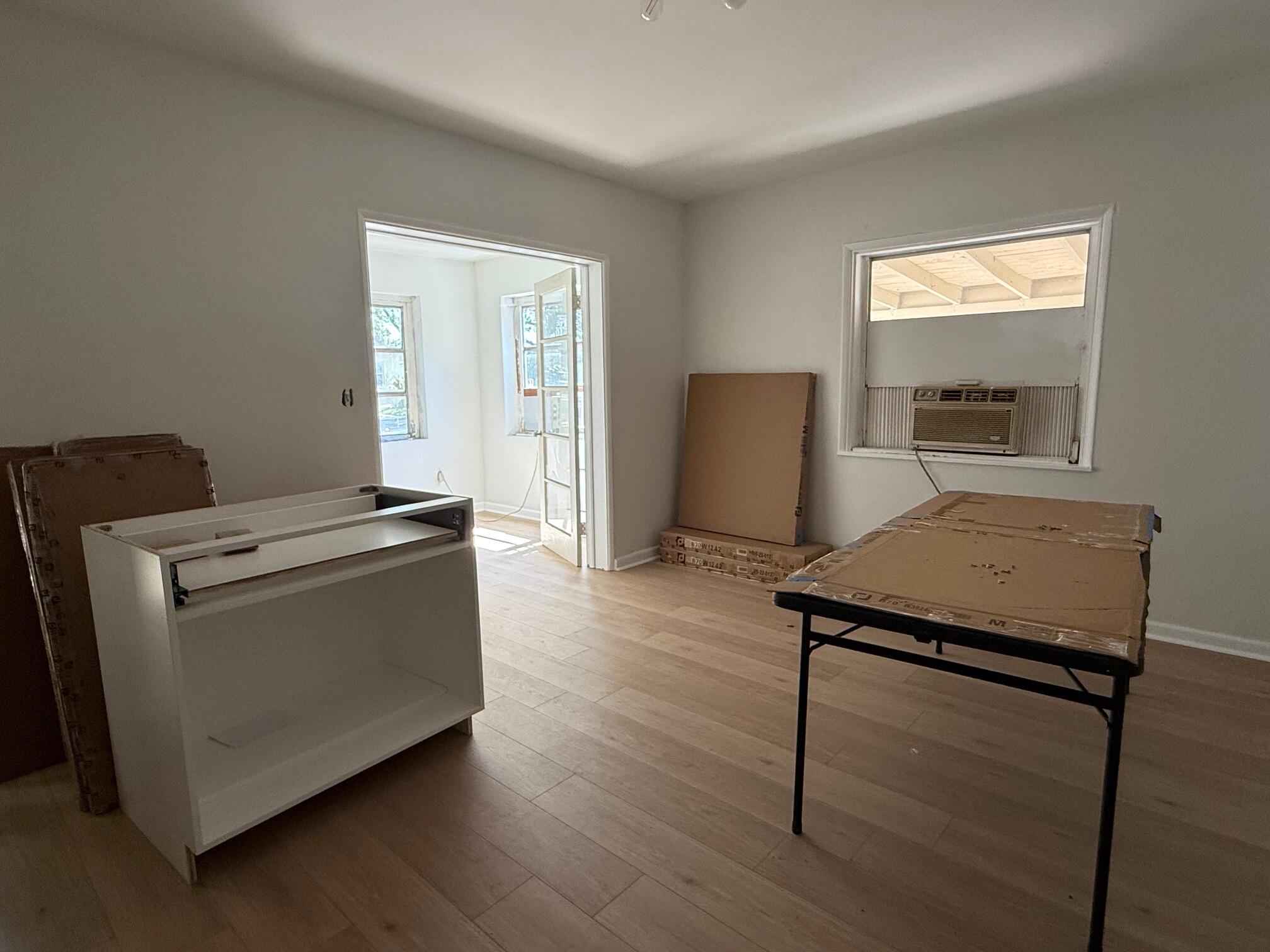 523 48th Street West Palm Beach, FL 33407 - Photo 10 of 33 a living room with furniture and a window