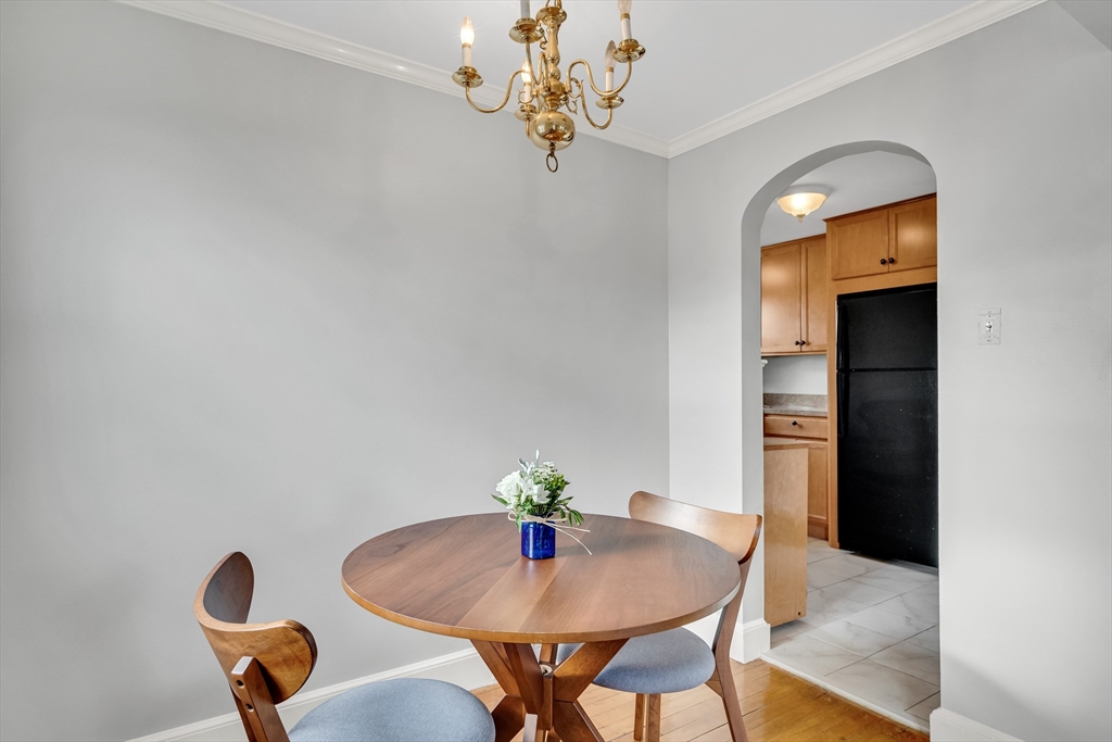 23 Weeks Avenue Boston, MA 02131 - Photo 12 of 34 a dining room with furniture and wooden floor