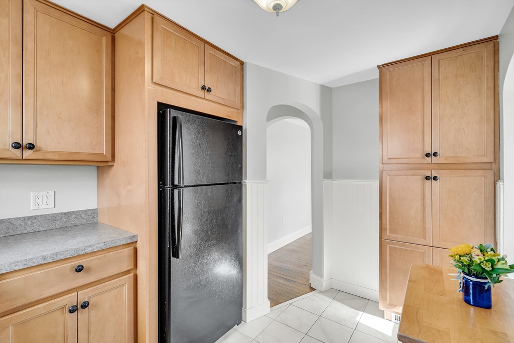 23 Weeks Avenue Boston, MA 02131 - Photo 16 of 34 a kitchen with stainless steel appliances a refrigerator and cabinets