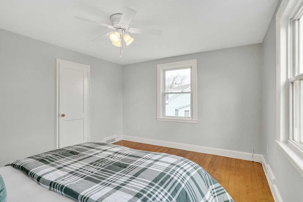 23 Weeks Avenue Boston, MA 02131 - Photo 21 of 34 a bedroom with a bed and a window