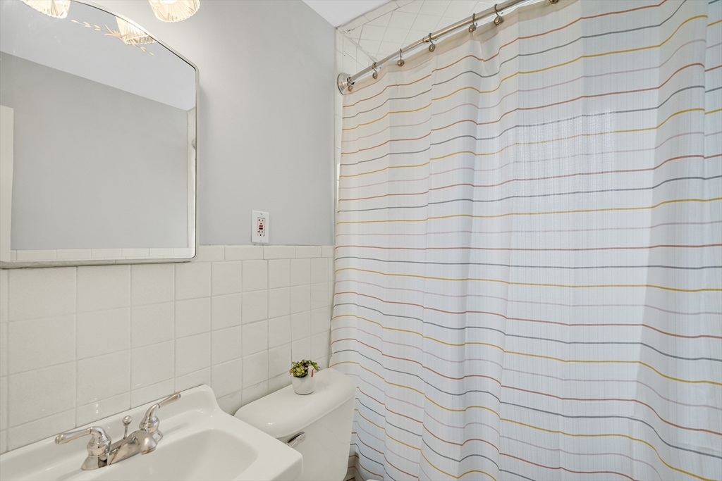 23 Weeks Avenue Boston, MA 02131 - Photo 25 of 34 a bathroom with a sink and shower