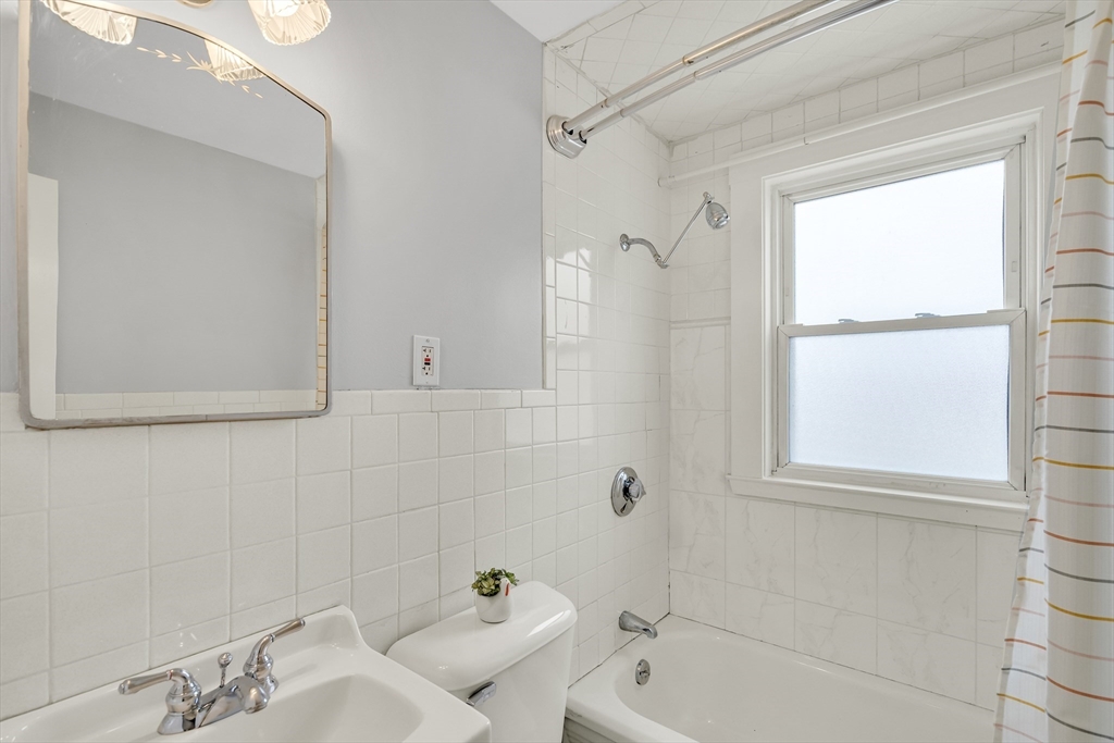 23 Weeks Avenue Boston, MA 02131 - Photo 26 of 34 a bathroom with a tub and window