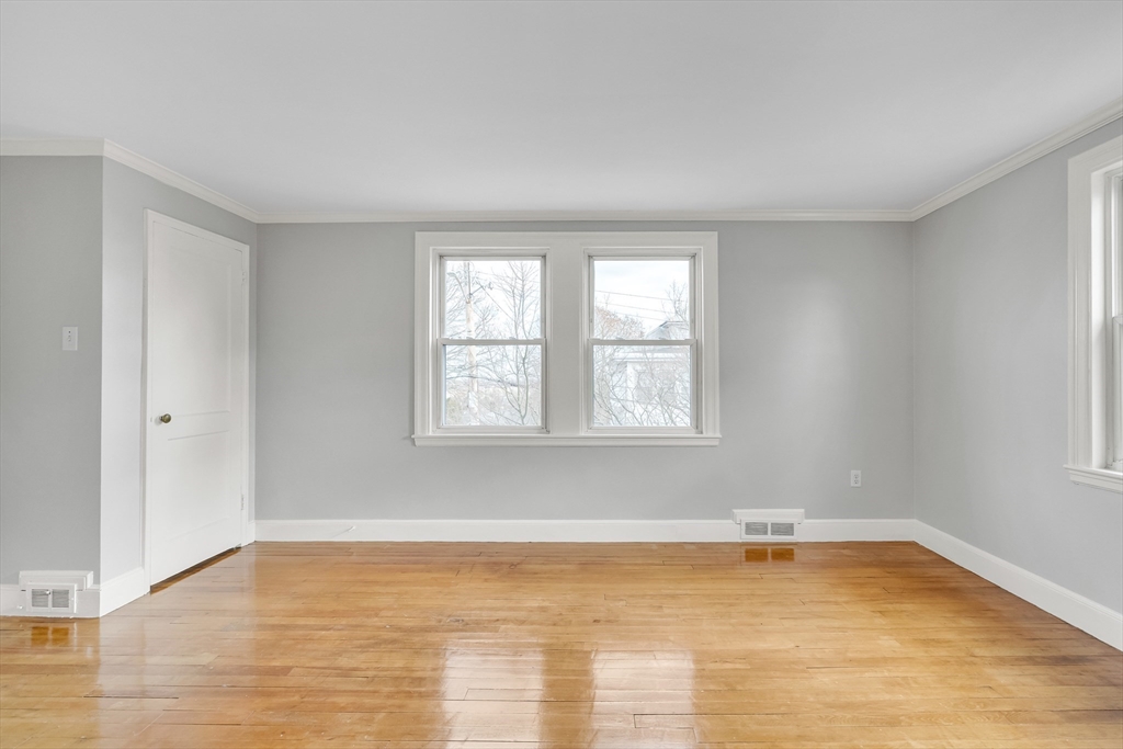 23 Weeks Avenue Boston, MA 02131 - Photo 6 of 34 wooden floor in an empty room with a window