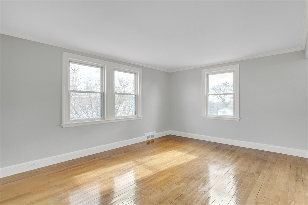 23 Weeks Avenue Boston, MA 02131 - Photo 7 of 34 a view of an empty room with a window